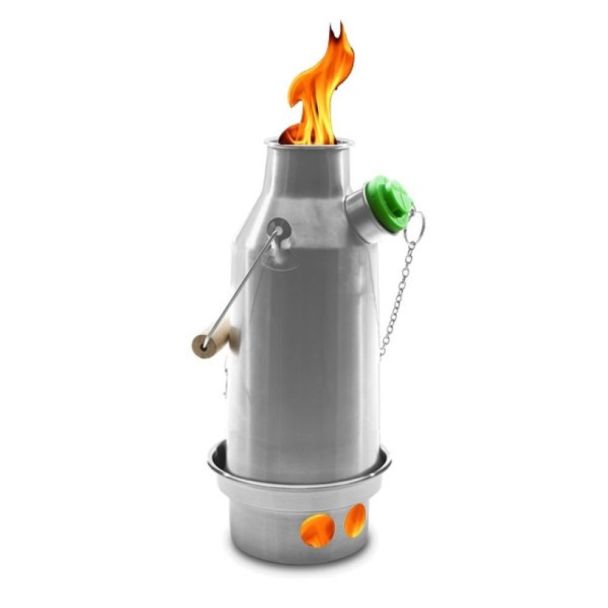 Kelly Kettle Small Trekker 0.6L stainless steel kettle on lit fire base, flames from top, green cap and chain, side view.