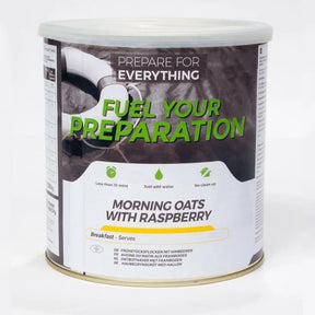 Cylindrical food tin with white and dark label reading "Fuel Your Preparation – Morning Oats With Raspberry", front view.